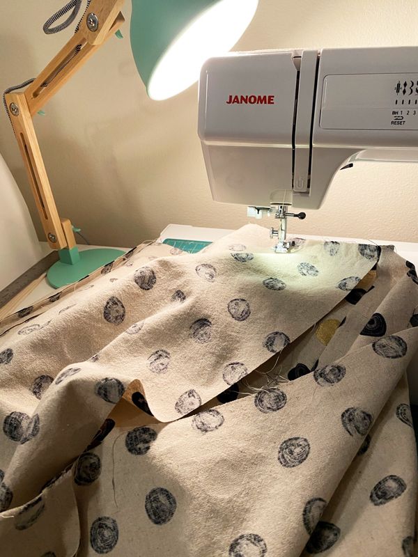 Partially-sewn-together pouf fabric in a sewing machine